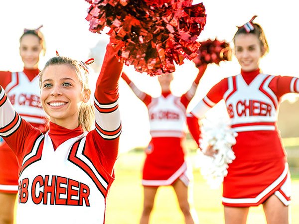 cheerleaders wearing red and white uniforms